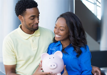 Couple with a piggy bank